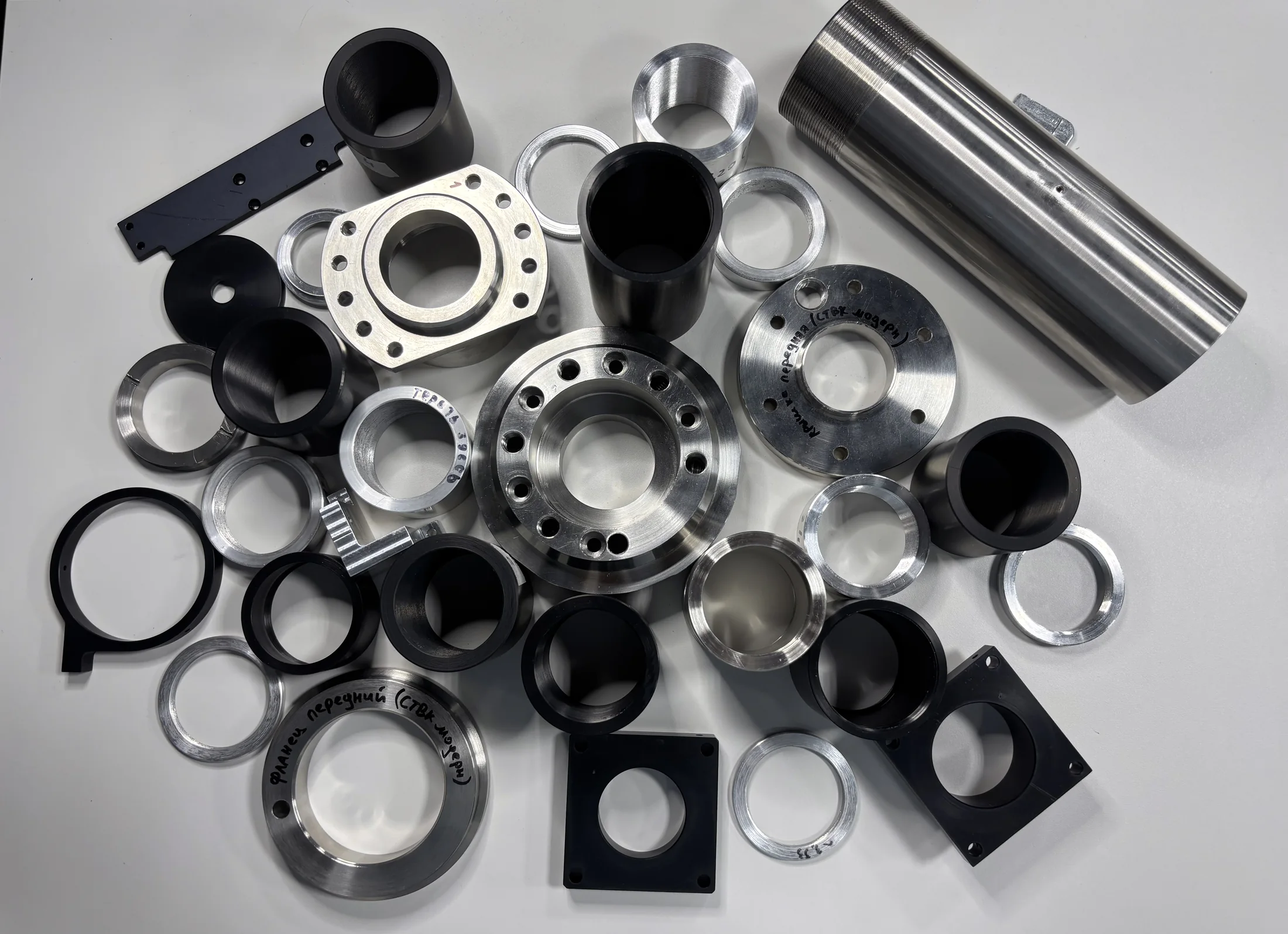 Finished optomechanical part with fasteners and threaded connections