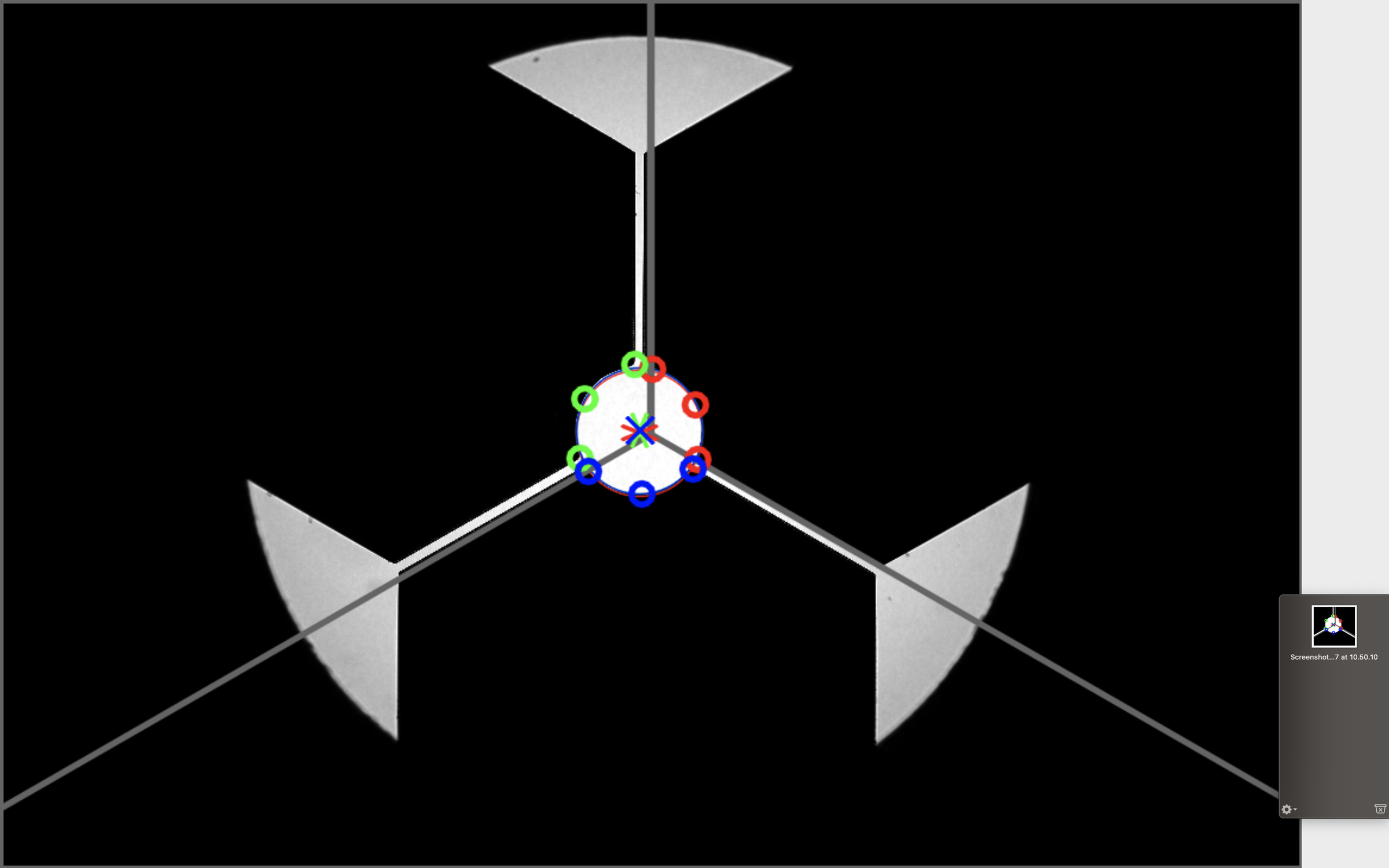 Rolling-stand camera frame with the coloured centre markers of three rolls aligned
