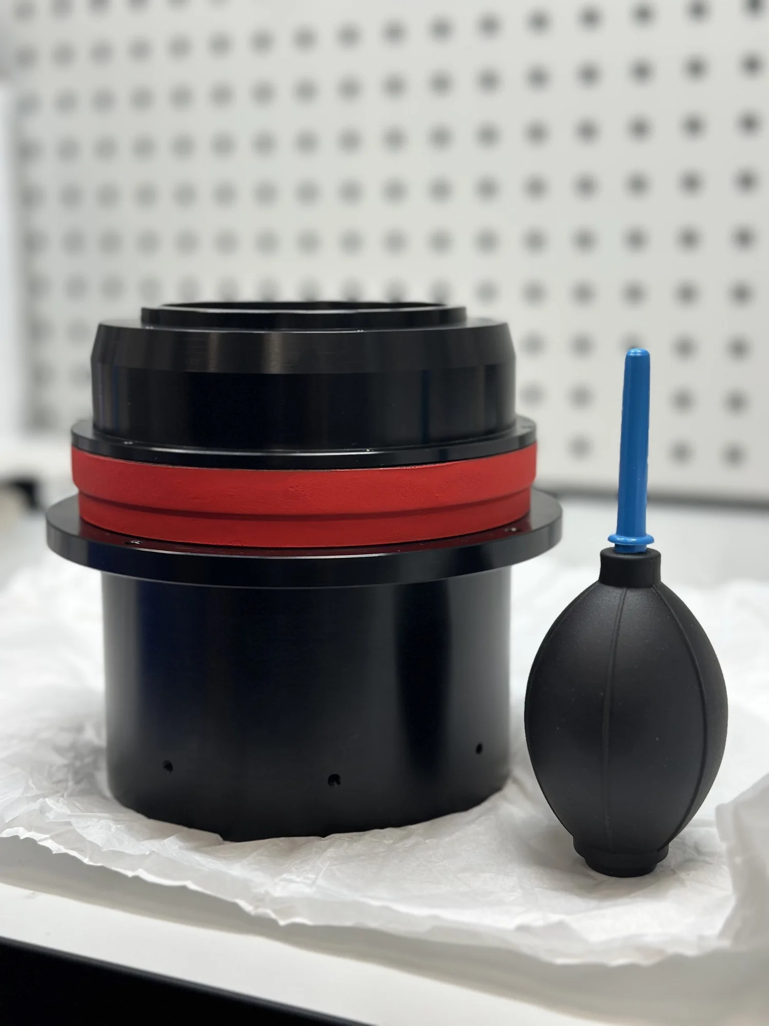 Black lens housing with an air blower on the cleanroom workbench